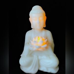 Flameless Candle Meditating Buddha Holding Lotus Flower